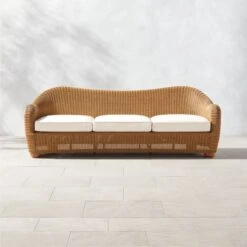 Bacio Natural Rattan Outdoor Sofa With Ivory Sunbrella® Cushions